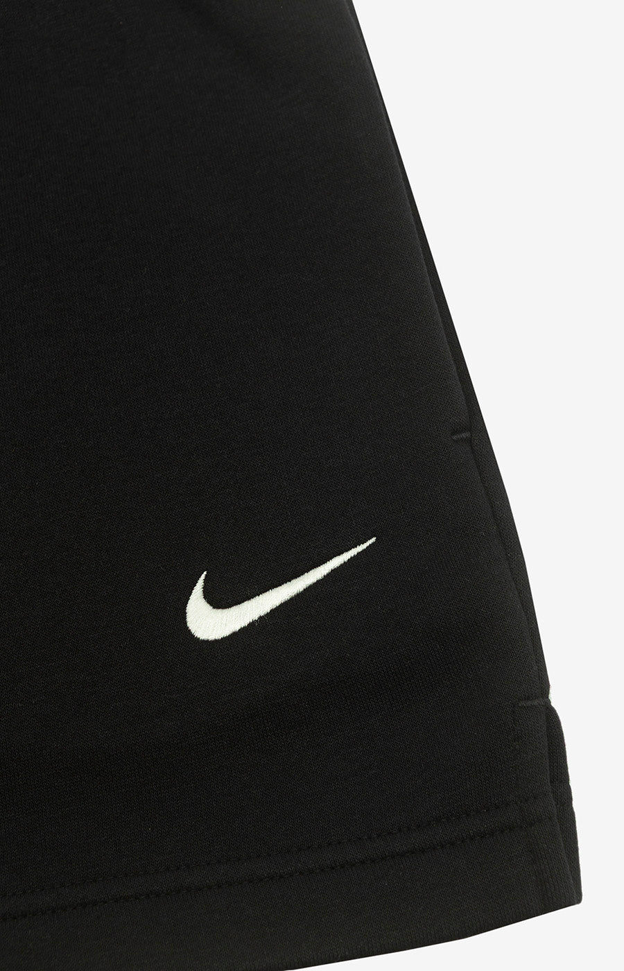 Close-up of the Nike swoosh on the leg of the Sporting Women's Staff 26/27 Shorts.