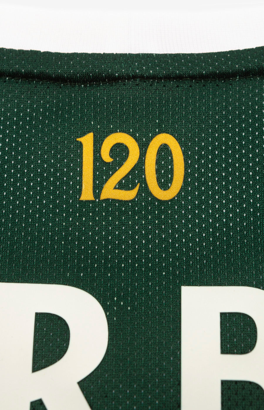 Close-up of the gold No. 120 on the back of Sporting's 26/27 Home Jersey.