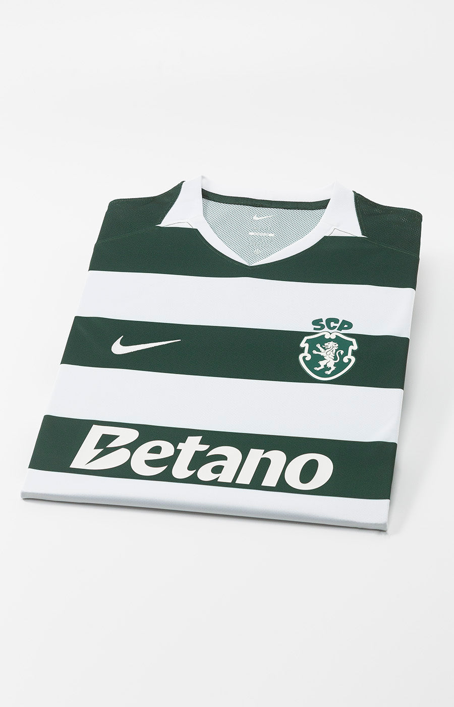 Sporting's 26/27 home jersey, folded, with the green and white stripes visible.