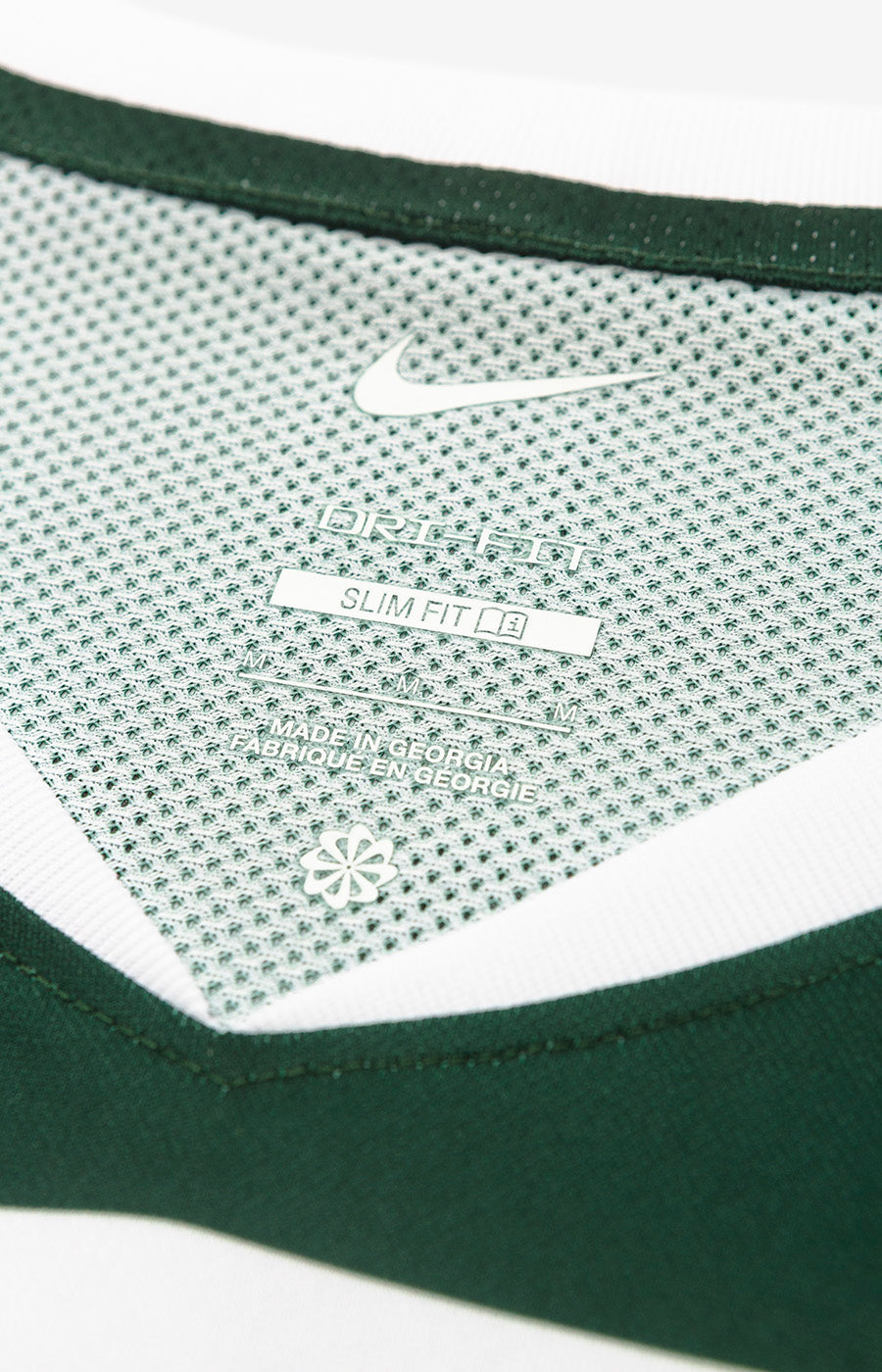 A close-up of the fabric of Sporting's 26/27 Home Jersey, showing the transition from green to white.