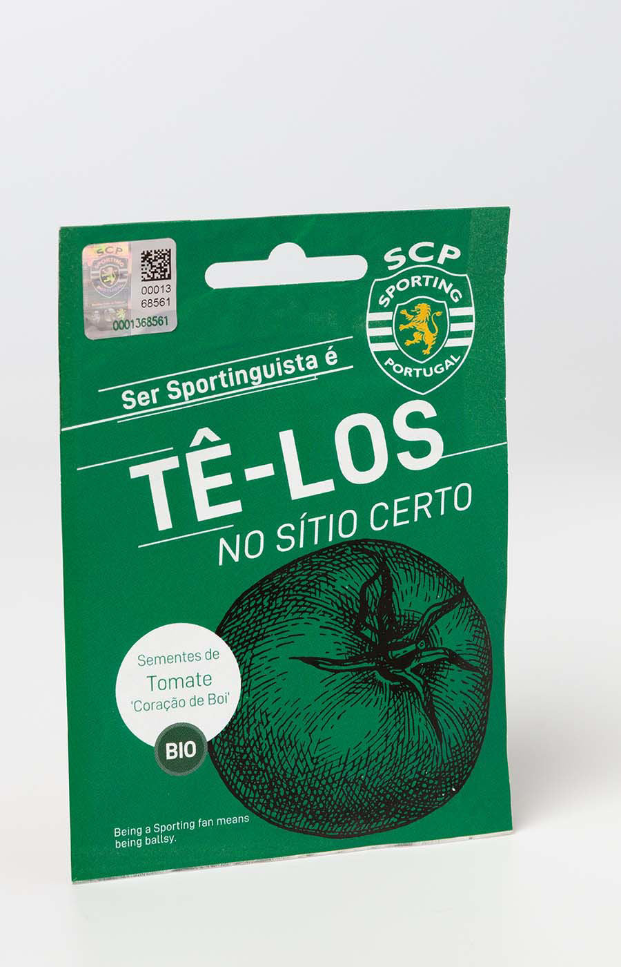 Saqueta de sementes biológicas de tomate do Sporting CP com design verde e mensagem Tê-los.
